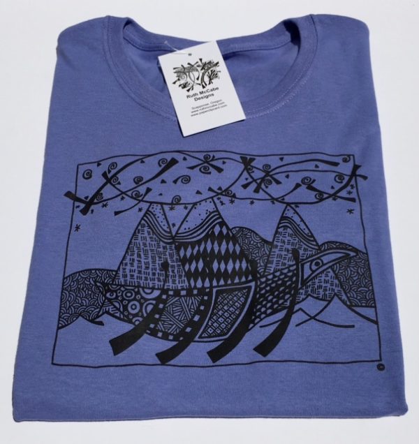 Photo of violet colored t-shirt with image of Ready, Ready! printed on the front.